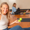 Woman exercising with a peanut roller