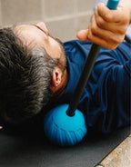 atom massage ball and massage stick used together 